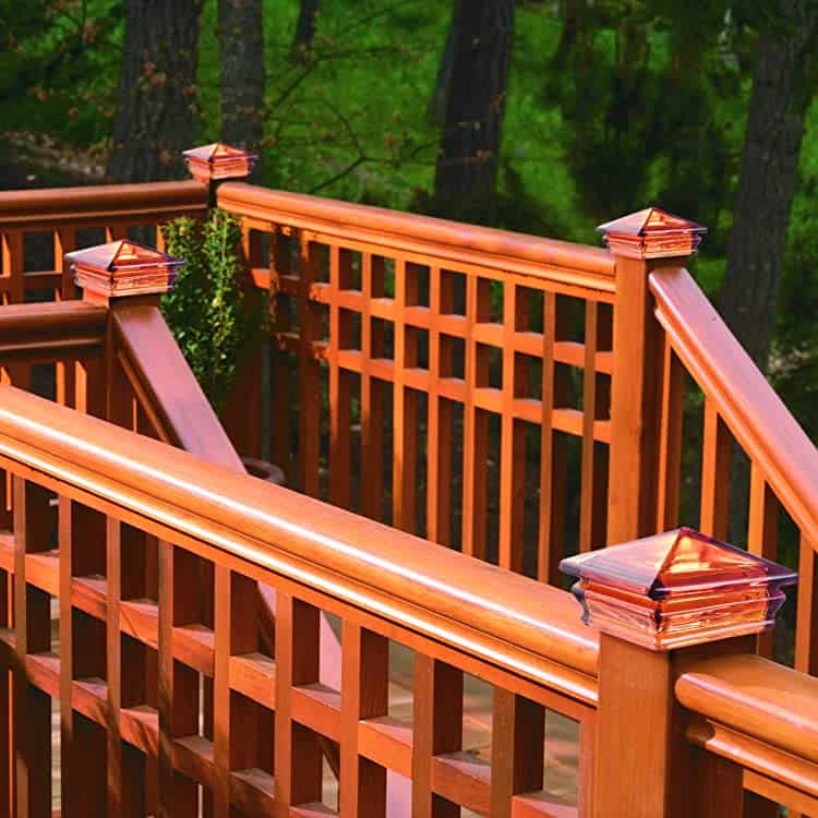 Ambered Yellow Glass Post Caps Top Railing Posts On A Beautiful Deck And Steps Down To A Wooded Yard.